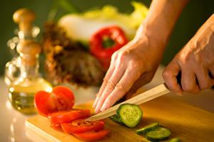 Person slicing vegetables