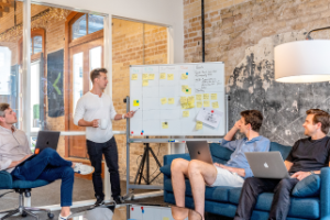 People looking at a whiteboard