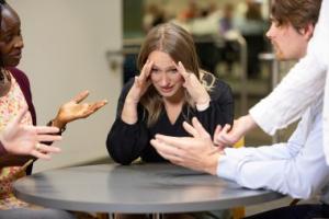 People at table discussing