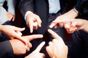 hands in a circle pointing