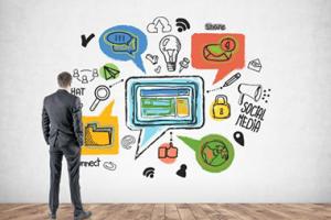 Man standing in front of infographic artwork